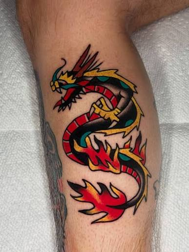 Traditional dragon tattoo on calf