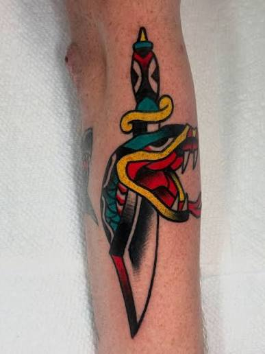 Traditional snake and dagger tattoo